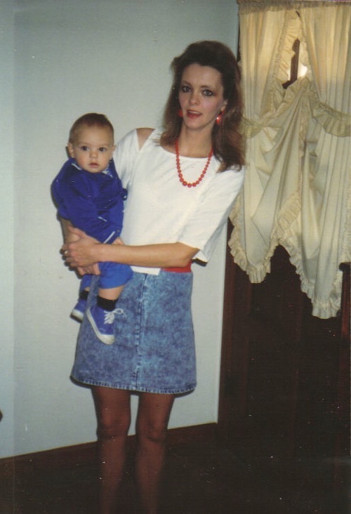 Rebecca holding her baby, 1980s