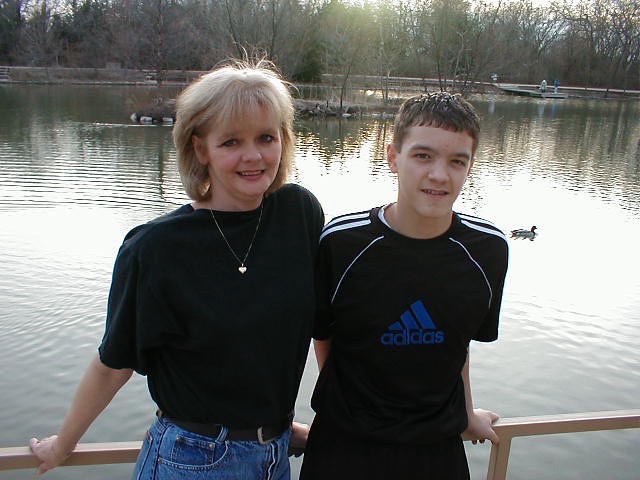 Rebecca with her son beside a lake · c. 2003