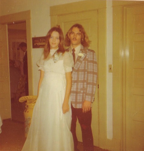 A young Rebecca in a white dress beside David, her husband, 1976