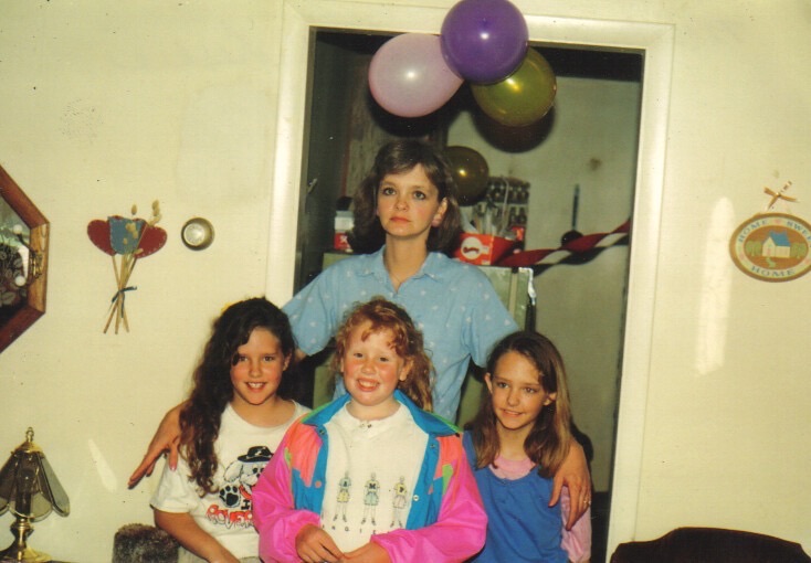 Rebecca with three young girls at a birthday party · c. 1988