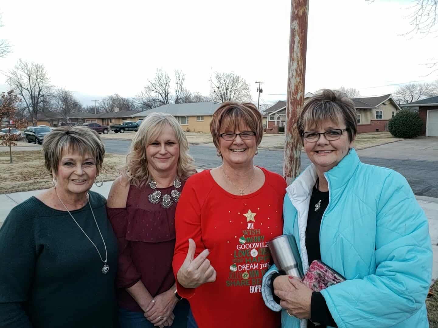 Rebecca with friends, dressed for the holidays · c. 2019